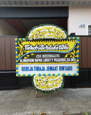 Papan Bunga Duka di Kutoanyar